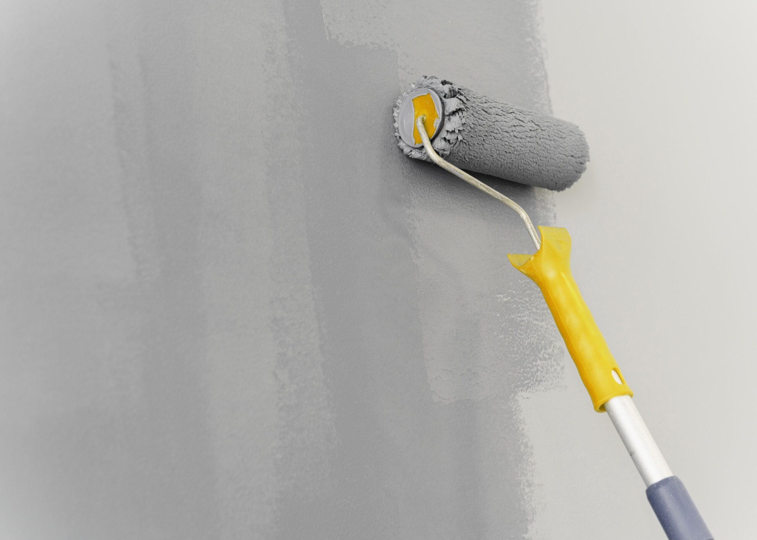 wall painting with roller concept scaled.jpg